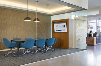 a conference room with a table and chairs